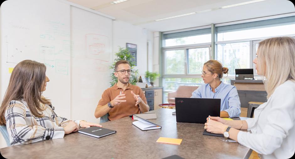 Tech graduates discussing digital ideas